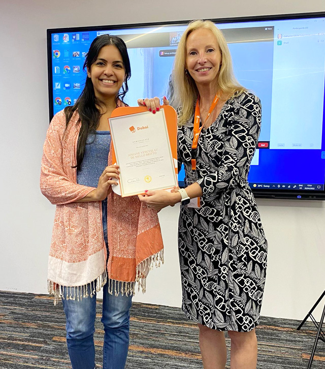 CELTA trainee receiving the certificate